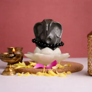 Money selenite flower with Lord Ganesha Pyrite Idol with black obsidian